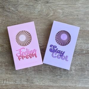 Face fan, rechargeable, USB cable charger included. Pink and purple available